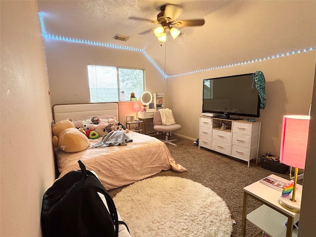 carpeted bedroom with visible vents, ceiling fan, a textured ceiling, and lofted ceiling