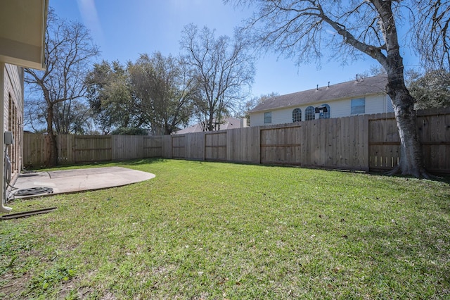 view of yard featuring a patio and a fenced backyard