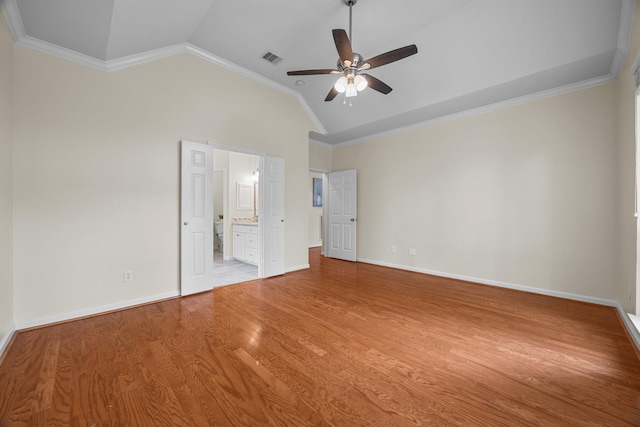 unfurnished bedroom with baseboards, visible vents, light wood-style floors, and crown molding