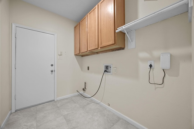 washroom featuring cabinet space, hookup for a washing machine, baseboards, and hookup for a gas dryer