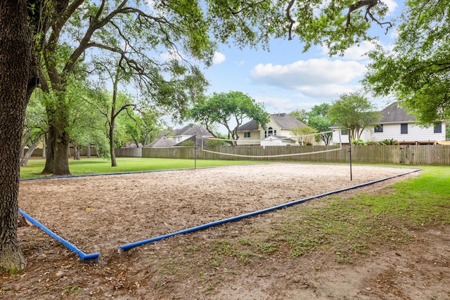 surrounding community featuring fence and volleyball court