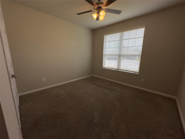 unfurnished room featuring baseboards, a ceiling fan, and carpet flooring