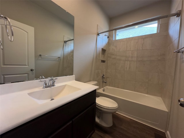 full bath with vanity, shower / bathing tub combination, toilet, and wood finished floors