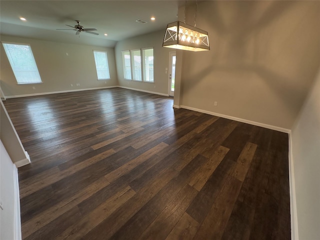 interior space featuring dark wood finished floors, visible vents, and baseboards