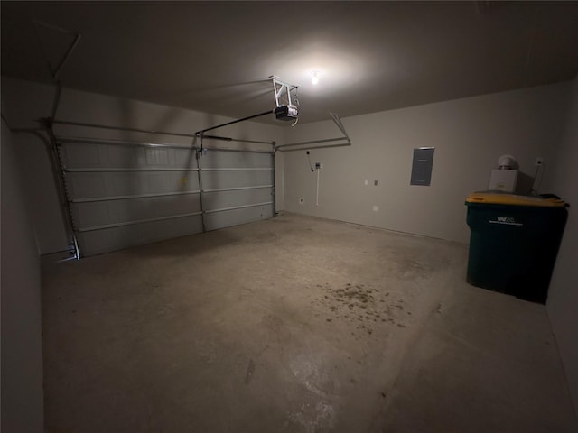 garage featuring electric panel and a garage door opener