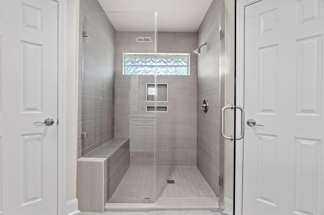 full bath featuring visible vents and a shower stall