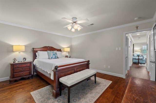 bedroom featuring baseboards, crown molding, and hardwood / wood-style flooring