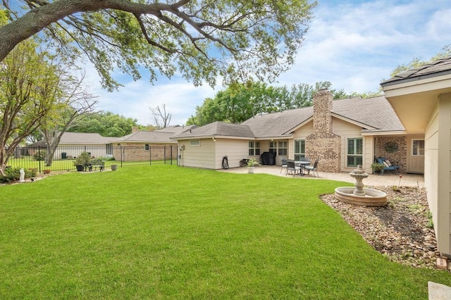 view of yard featuring fence and a patio area