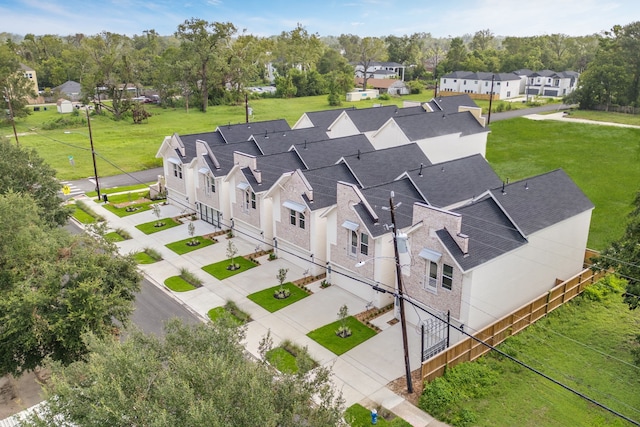 birds eye view of property with a residential view