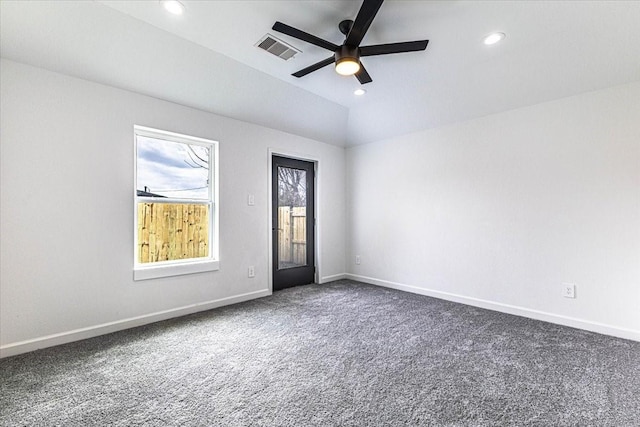 carpeted spare room featuring a ceiling fan, recessed lighting, baseboards, and visible vents