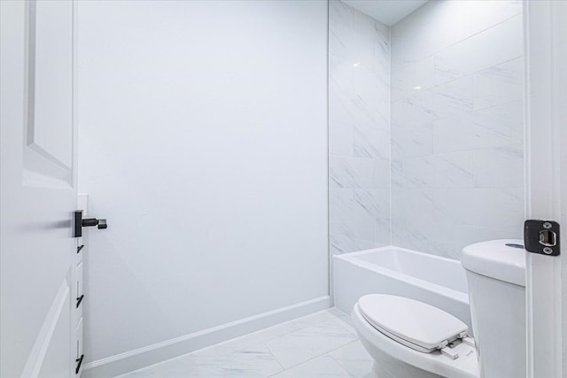 full bathroom featuring washtub / shower combination, toilet, baseboards, and marble finish floor