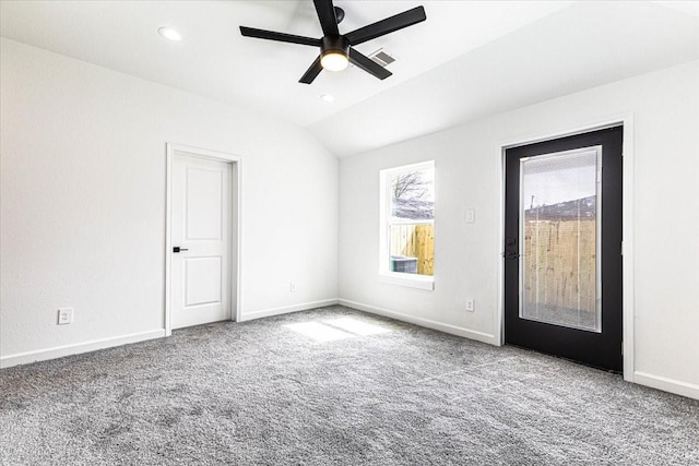 empty room featuring carpet, visible vents, and baseboards