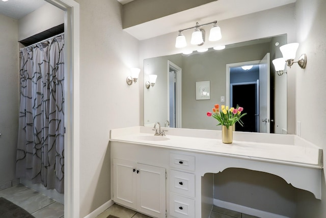 bathroom with baseboards, a shower with curtain, and vanity