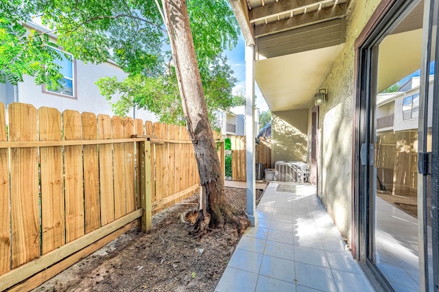 view of patio / terrace featuring fence