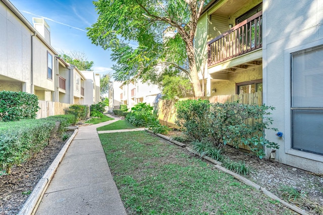 surrounding community with fence and a residential view