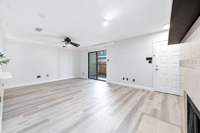 unfurnished room with visible vents, baseboards, a ceiling fan, and light wood finished floors