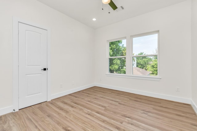 spare room featuring recessed lighting, visible vents, baseboards, and light wood-style flooring