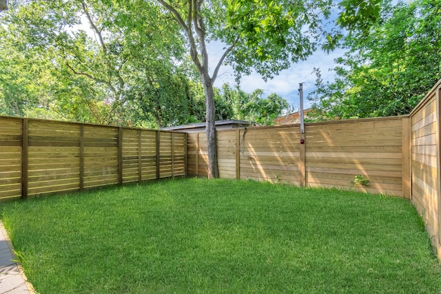 view of yard featuring a fenced backyard