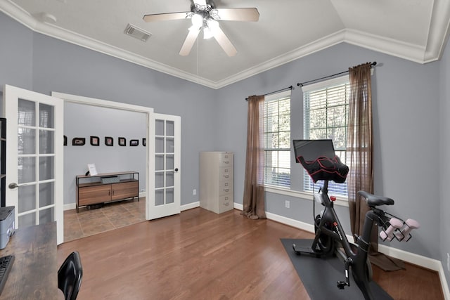 exercise area featuring french doors, visible vents, wood finished floors, and crown molding