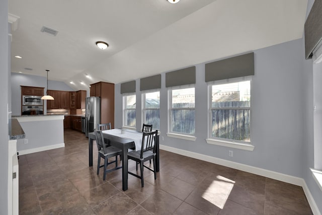 dining space with recessed lighting, visible vents, baseboards, and vaulted ceiling