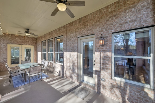 view of patio / terrace with outdoor dining space, french doors, and a ceiling fan