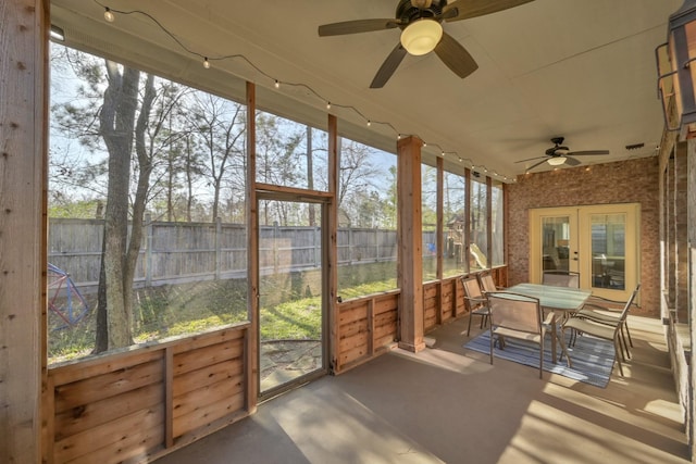 sunroom / solarium with a wealth of natural light and a ceiling fan