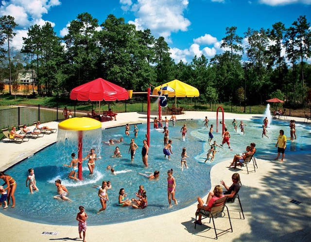 view of pool with fence