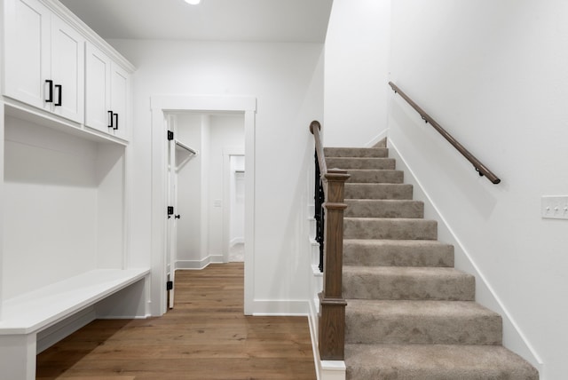 interior space featuring wood finished floors and baseboards