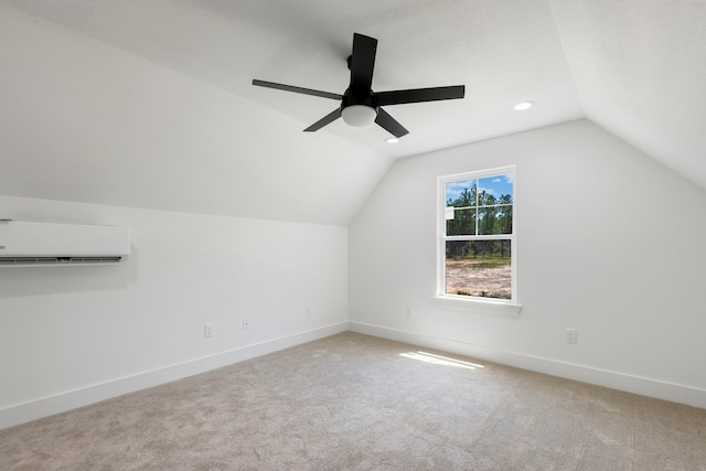 additional living space with lofted ceiling, a wall mounted AC, carpet floors, baseboards, and ceiling fan