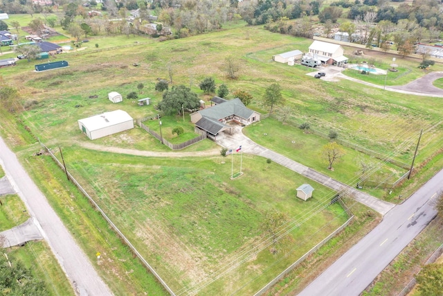 birds eye view of property featuring a rural view