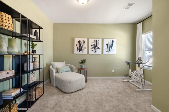 sitting room featuring visible vents, baseboards, and carpet floors