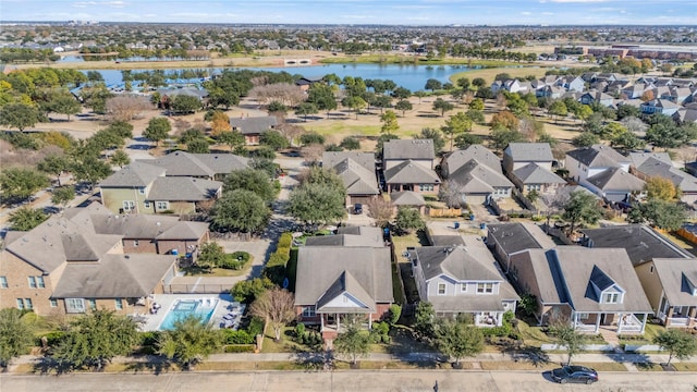 birds eye view of property with a residential view and a water view