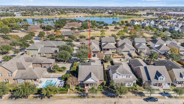 birds eye view of property featuring a residential view and a water view