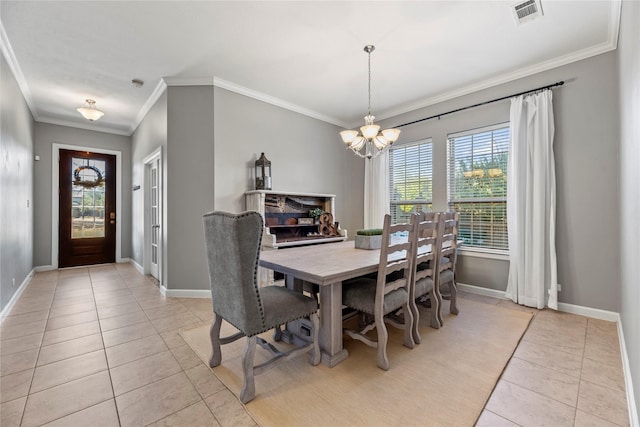 dining room with visible vents, crown molding, baseboards, light tile patterned floors, and a notable chandelier