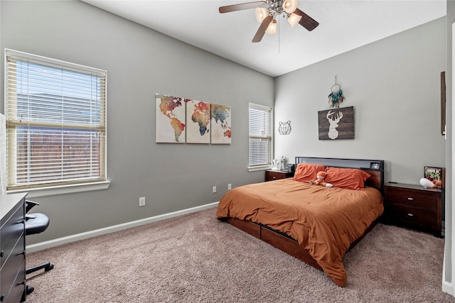 carpeted bedroom with baseboards and ceiling fan