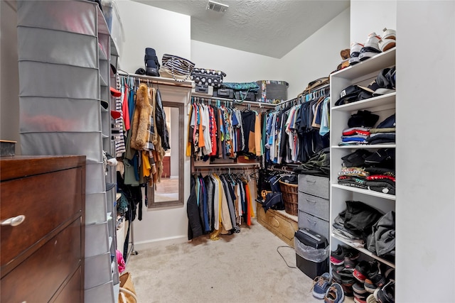 spacious closet featuring visible vents and carpet