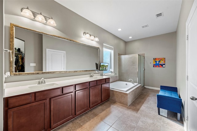 full bathroom featuring visible vents, a sink, a shower stall, double vanity, and a bath