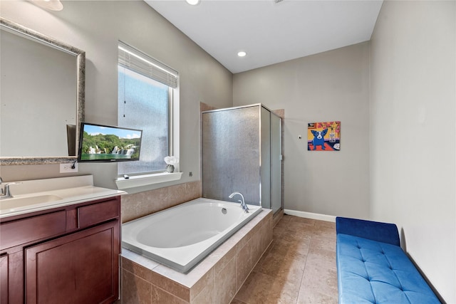 bathroom featuring tile patterned floors, recessed lighting, a stall shower, a bath, and vanity