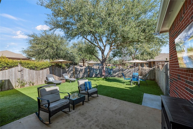 view of yard featuring a patio and a fenced backyard