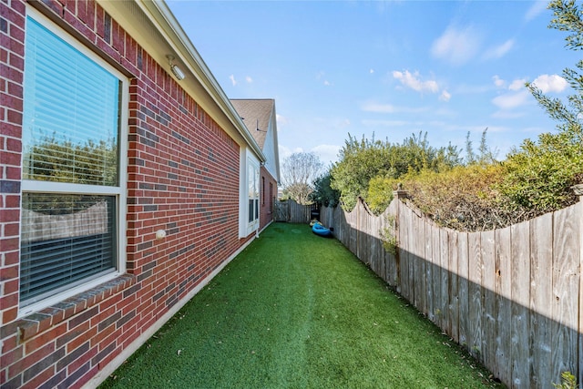 view of yard featuring a fenced backyard