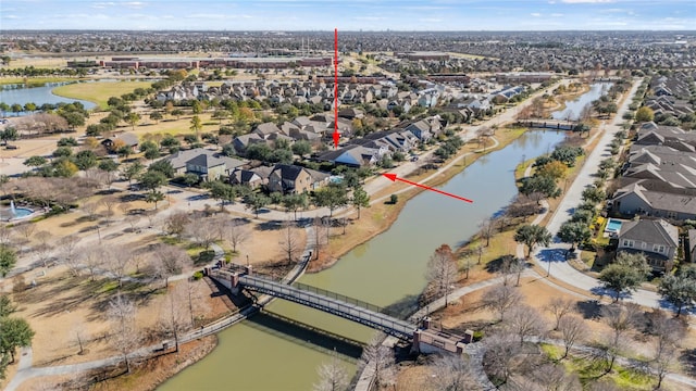 aerial view featuring a residential view and a water view