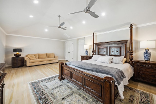 bedroom featuring vaulted ceiling, light wood-style floors, and ornamental molding