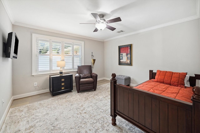 bedroom featuring a ceiling fan, crown molding, visible vents, and baseboards