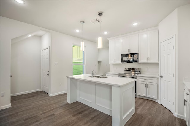 kitchen with visible vents, a center island with sink, a sink, stainless steel range with electric cooktop, and black microwave