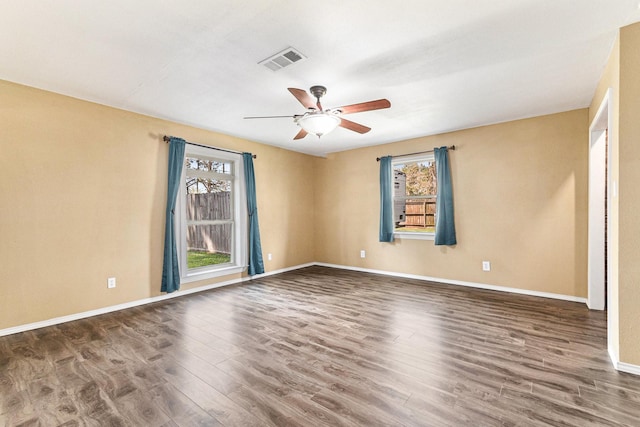 19331 E Lakeshore Dr, Magnolia, TX 77355 - spare room featuring plenty of natural light, wood finished floors, and a ceiling fan