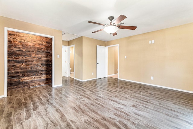 19331 E Lakeshore Dr, Magnolia, TX 77355 - spare room with ceiling fan, wood finished floors, and baseboards