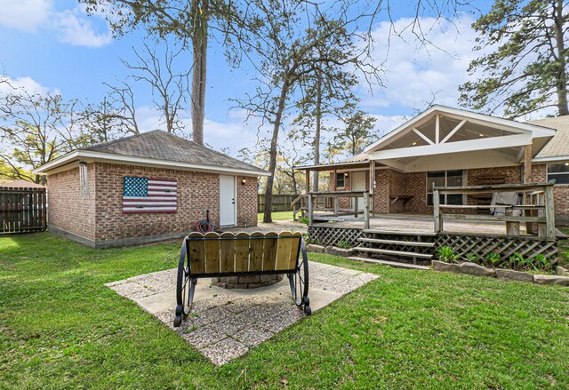 19331 E Lakeshore Dr, Magnolia, TX 77355 - view of yard featuring a deck, a patio, and an outbuilding