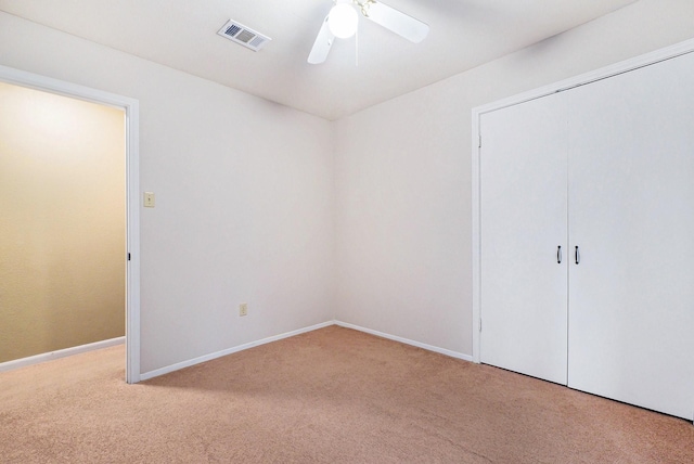 19331 E Lakeshore Dr, Magnolia, TX 77355 - unfurnished bedroom featuring carpet, a closet, baseboards, and ceiling fan