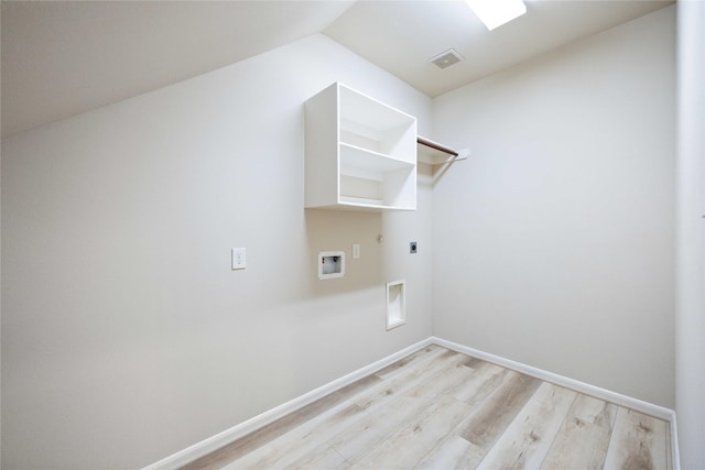 washroom featuring baseboards, laundry area, electric dryer hookup, washer hookup, and light wood-type flooring