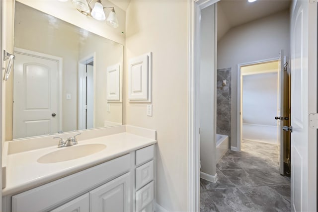 full bathroom with vanity,  shower combination, and baseboards